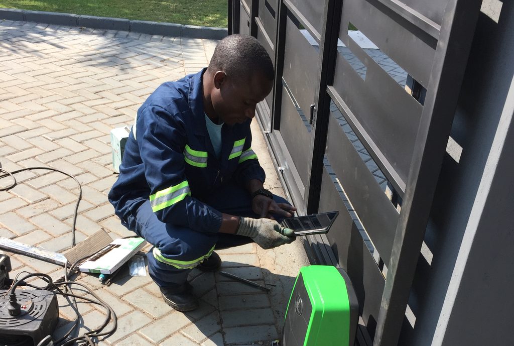 Smarttech Security technician installing a gate automation motor